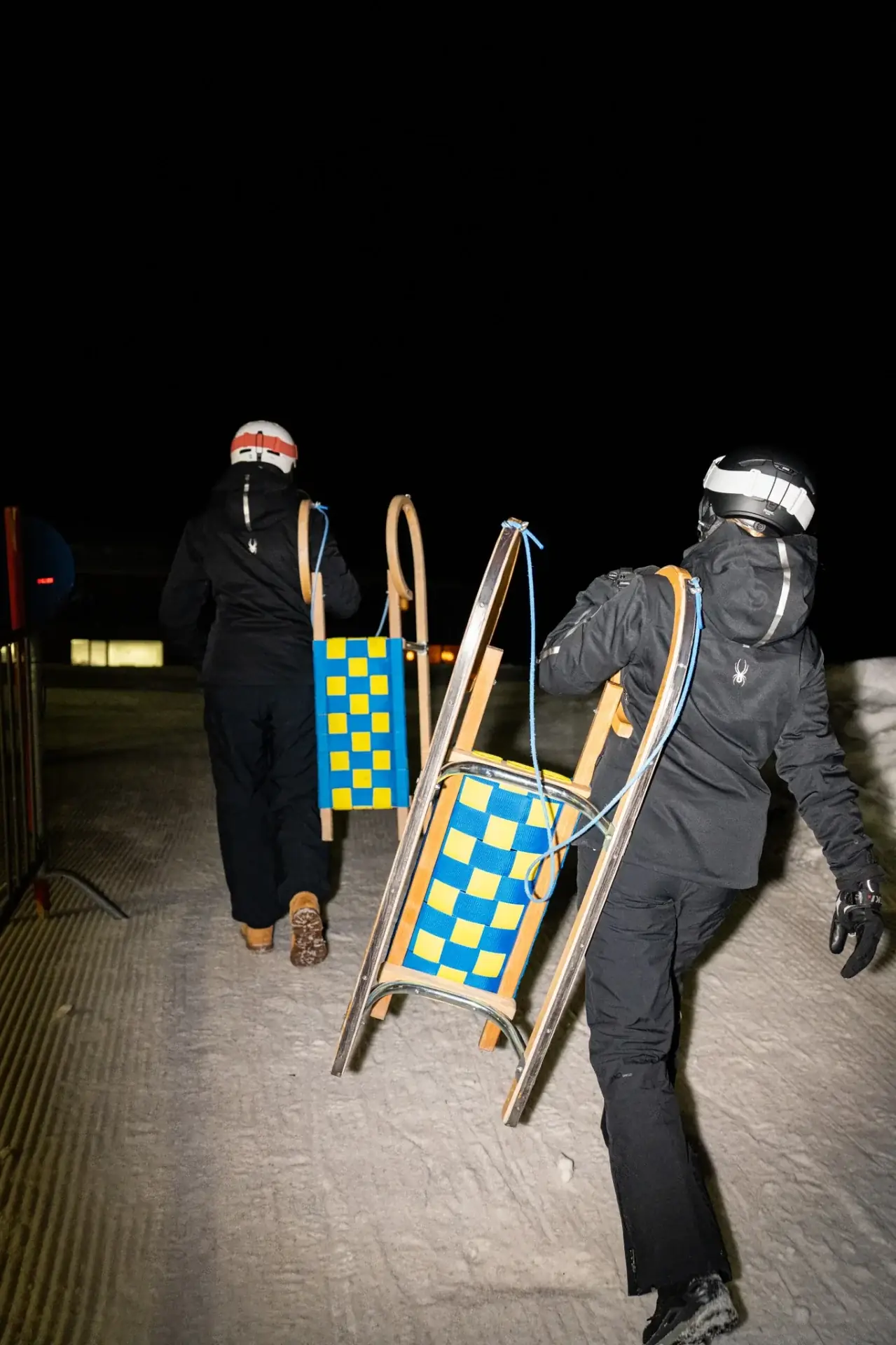 Night tobogganing on the floodlit toboggan run in Ischgl